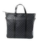 Louis Vuitton Tadao PM tote in black Damier Graphite check canvas with black leather top handles and vertical leather trim on white background