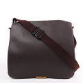 Louis Vuitton Taiga Viktor Shoulder Bag M30146 in burgundy textured leather with a matching adjustable canvas strap and gold-tone logo plate, displayed upright against a white background.