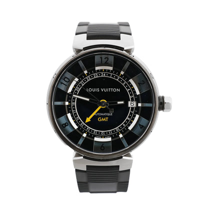 Louis Vuitton Tambour Q113K GMT watch with a black dial, yellow GMT hand, date window at 3 o’clock, stainless steel case, and black rubber strap.