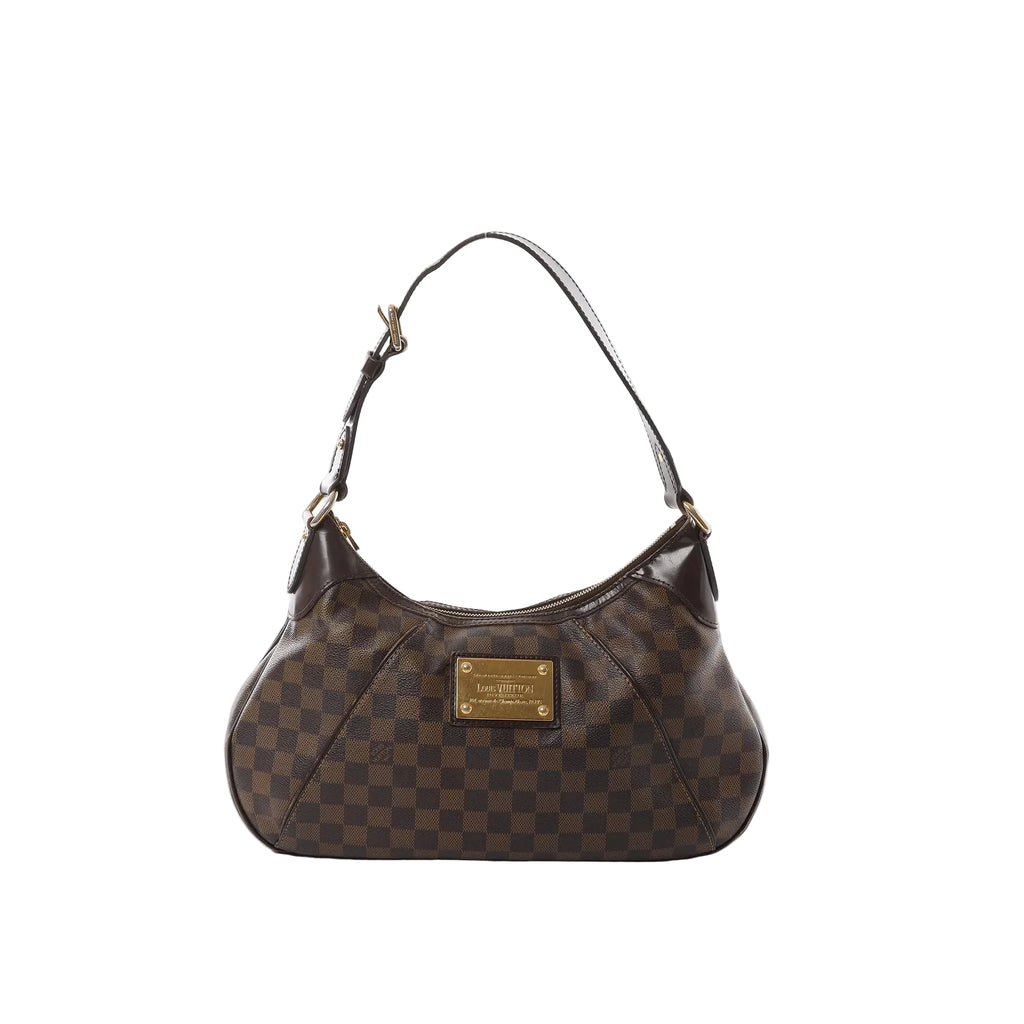 Louis Vuitton Thames GM Damier Ebene shoulder bag in brown check canvas with dark leather trim, gold-tone plaque, and zip-top closure, front view on white background.