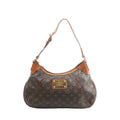 Louis Vuitton Thames GM shoulder bag in brown Monogram canvas with tan leather trim, adjustable shoulder strap, and gold-tone logo plaque, front view on white background.