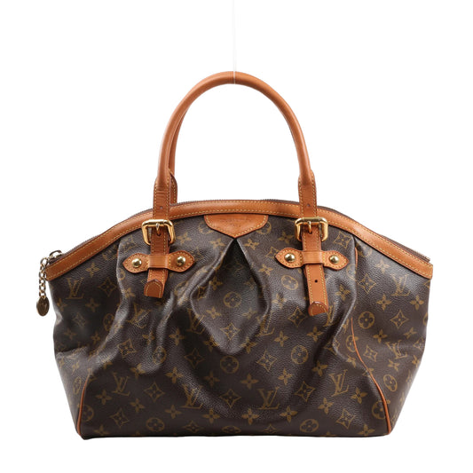 Louis Vuitton Tivoli GM handbag M40144 in brown Monogram canvas with structured top handles, pleated body, gold-tone hardware, and natural leather trim, displayed upright on a white background.