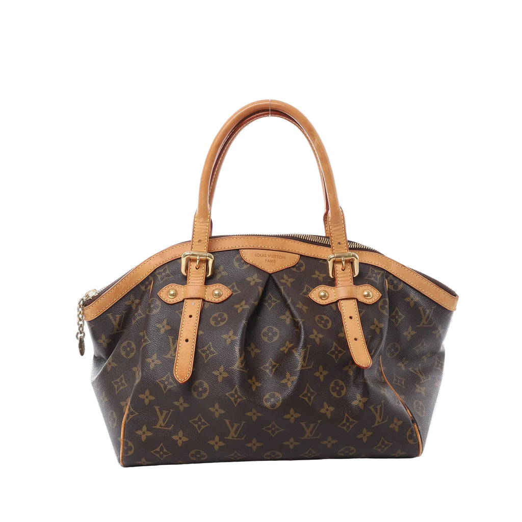 Louis Vuitton Tivoli GM handbag in brown Monogram canvas with tan vachetta leather trim, pleated front, top handles, and gold-tone hardware on white background.
