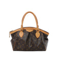 Louis Vuitton Tivoli PM handbag in brown Monogram canvas with natural leather trim, dual rolled top handles, pleated front detail and zip-top closure.