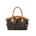 Louis Vuitton Tivoli PM handbag in brown Monogram canvas with natural leather trim, dual rolled top handles, pleated front detail and zip-top closure.