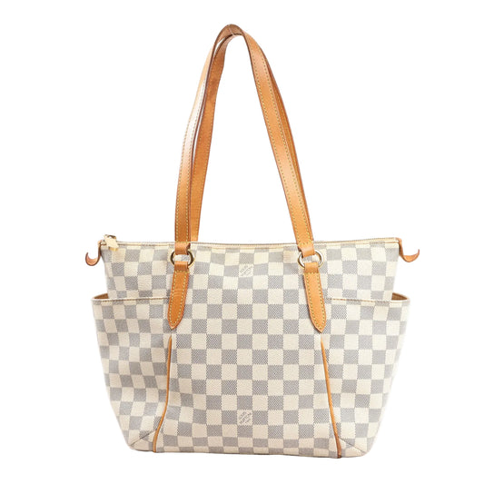 Front view of the Louis Vuitton Totally PM shoulder bag N41280 in beige Damier Azur canvas, featuring natural leather straps, side pockets, and gold-tone hardware.