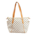 Front view of the Louis Vuitton Totally PM shoulder bag N41280 in beige Damier Azur canvas, featuring natural leather straps, side pockets, and gold-tone hardware.