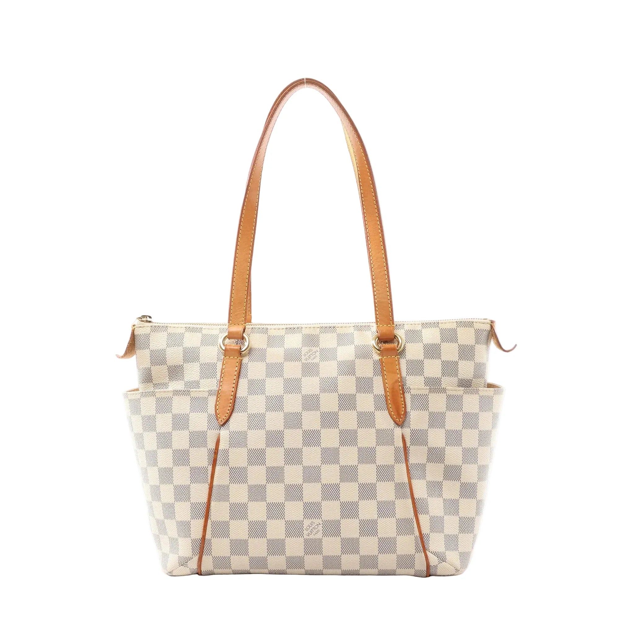 Louis Vuitton Totally PM Damier Azur tote in beige checkered canvas with long vachetta leather shoulder straps, top zip closure, and slim vertical leather trim details on the front, shown on a white background.