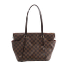 Brown Louis Vuitton Totally PM Damier Ebene shoulder bag with checkerboard canvas, long dark leather handles, top zip closure and side pockets.
