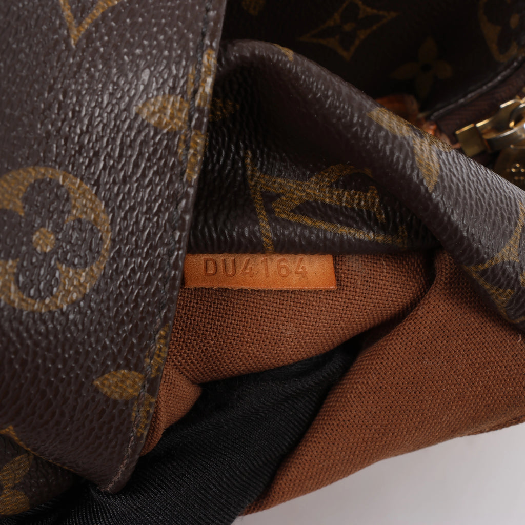 Bolso de hombro Louis Vuitton Totally PM Monogram de lona en marrón M56688