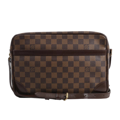 Louis Vuitton Damier Ebene Trocadero 30 Crossbody Bag N48082 in brown checkered coated canvas with dark brown leather trim, front pocket, and adjustable shoulder strap, displayed upright against a white background.