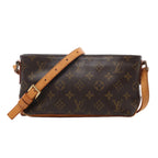 Brown Louis Vuitton Trotteur Monogram canvas crossbody bag with tan leather trim, adjustable shoulder strap and rectangular silhouette.