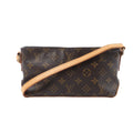 Louis Vuitton Trotteur crossbody bag in brown Monogram canvas with a tan adjustable leather strap, top zip closure and slim rectangular shape.
