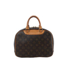 Louis Vuitton Trouville handbag in brown Monogram canvas with natural leather trim, dual rolled top handles, structured silhouette and zip-top closure.