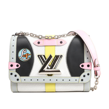 Louis Vuitton Twist MM shoulder bag in multicolor Epi leather featuring pastel pink, yellow, black, and light blue panels, a silver-tone LV twist-lock closure, decorative patch, and a silver chain strap with leather shoulder detail.