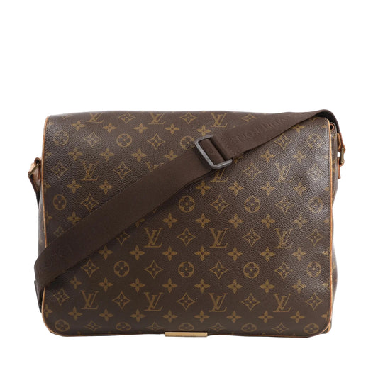 Louis Vuitton Valmy GM messenger bag in brown Monogram canvas with flap closure, wide adjustable brown fabric strap, and gold-tone hardware.