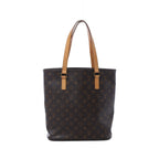 Brown Louis Vuitton Vavin GM Monogram canvas tote bag with long tan leather shoulder handles and gold-tone hardware.