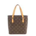 Louis Vuitton Vavin PM shoulder bag in brown Monogram coated canvas with natural cowhide leather shoulder straps, structured tote silhouette, and gold-tone hardware on a white background.