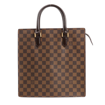 Louis Vuitton Venice PM handbag in brown Damier Ebene canvas featuring a boxy structured silhouette, dual rolled leather top handles, and gold-tone hardware accents.