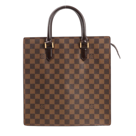 Louis Vuitton Venice PM handbag in brown Damier Ebene canvas featuring a boxy structured silhouette, dual rolled leather top handles, and gold-tone hardware accents.