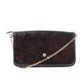 Louis Vuitton Félicie Pochette in dark brown Monogram Vernis leather with envelope flap, gold-tone snap closure and chain shoulder strap.