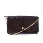 Louis Vuitton Félicie Pochette in dark brown Monogram Vernis leather with envelope flap, gold-tone snap closure and chain shoulder strap.