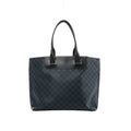 Navy blue Louis Vuitton Cabas Voyage tote in Damier Cobalt checkered canvas with black leather trim, long shoulder handles and silver-tone hardware.