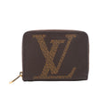 Brown Louis Vuitton Zippy wallet with an oversized tan LV motif, rounded corners and a gold-tone zip-around closure.
