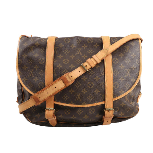 Louis Vuitton Monogram Canvas Saumur 43 Crossbody Bag M42252 in brown monogram coated canvas with natural leather trim, adjustable shoulder strap, and dual front buckle closures, displayed against a white background.