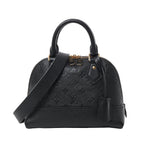 Front view of Louis Vuitton Monogram Empreinte Alma BB 2Way Handbag M44829 in black leather, with embossed LV monogram pattern, gold-tone hardware, dual top handles, and detachable shoulder strap against a white background.