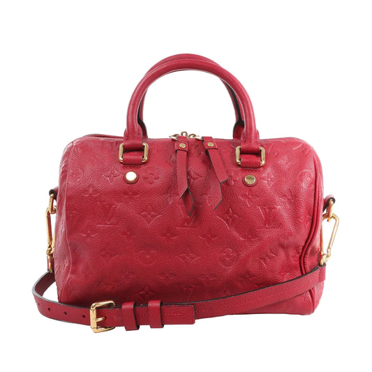 Front view of the Louis Vuitton Monogram Empreinte Speedy 25 Bandoulière Handbag M40827 in red, featuring soft embossed leather with the LV monogram pattern, dual top handles, detachable shoulder strap with gold-tone hardware, and zip closure, set against a white background.