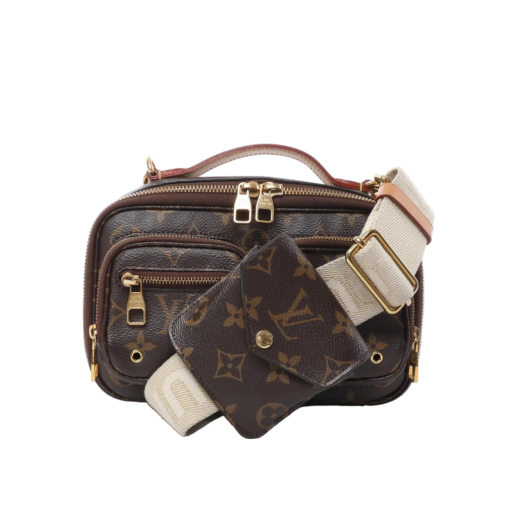Louis Vuitton Utility crossbody bag in brown Monogram canvas with double zipper pulls, front zip pocket, wide cream canvas strap with gold buckle, and detachable Monogram pouch, on white background