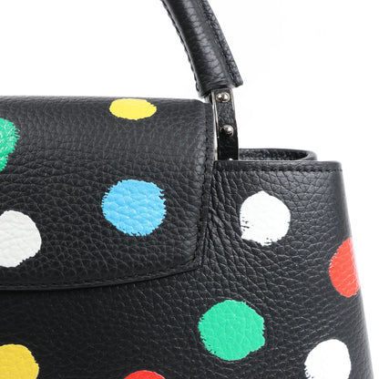 Sac à main Louis Vuitton x Taurillon Capucines MM 2 en 1 noir M21663