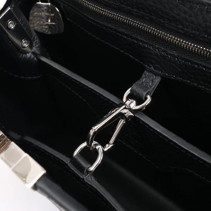 Sac à main Louis Vuitton x Taurillon Capucines MM 2 en 1 noir M21663