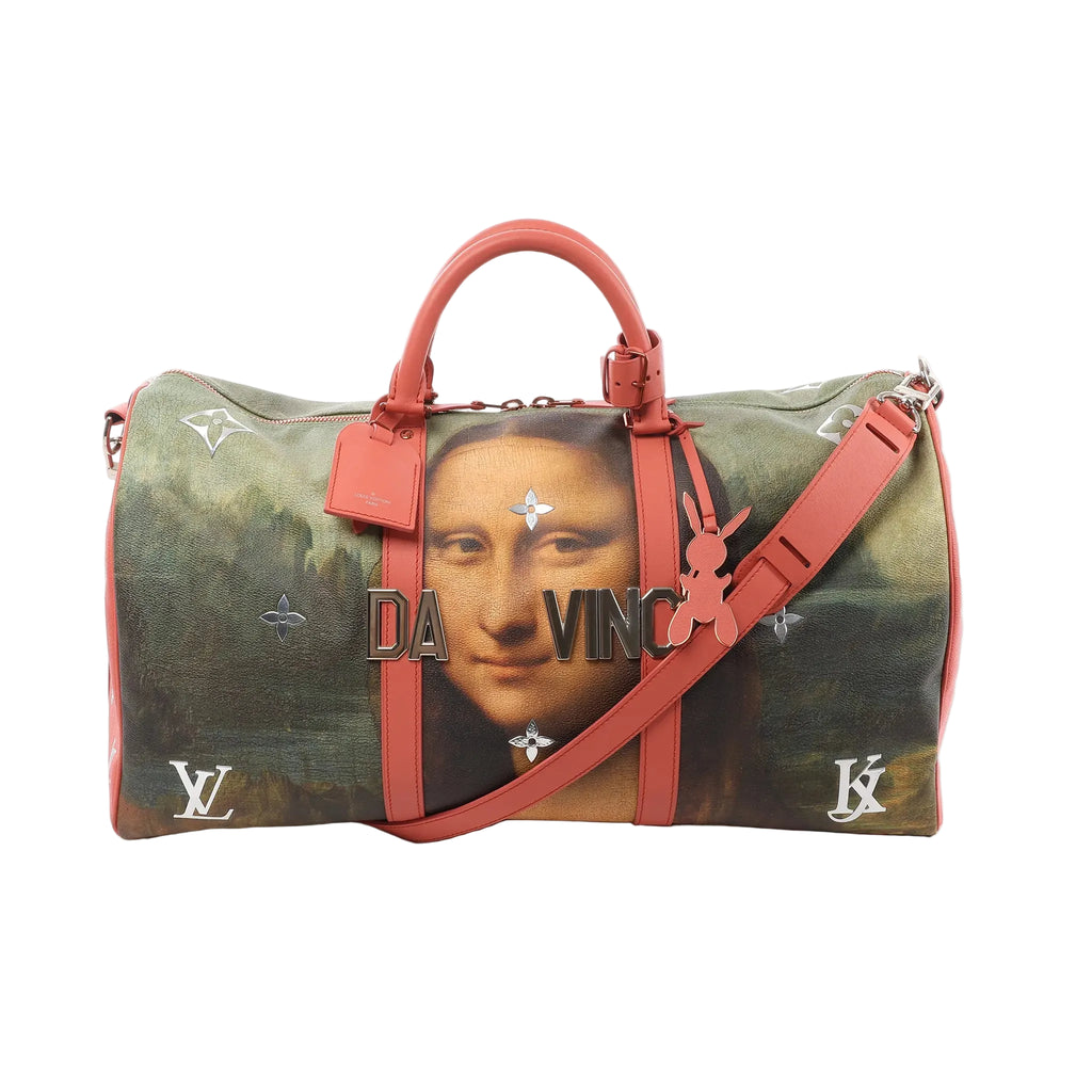 Louis Vuitton Keepall 50 travel bag with Mona Lisa artwork print, “DA VINCI” lettering, pink leather top handles and trim, detachable pink shoulder strap, and LV and JK initials on the corners.