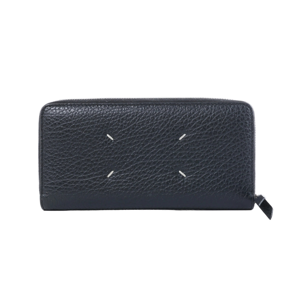 Maison Margiela black textured leather zip-around wallet with four white signature stitches and black zipper pull.