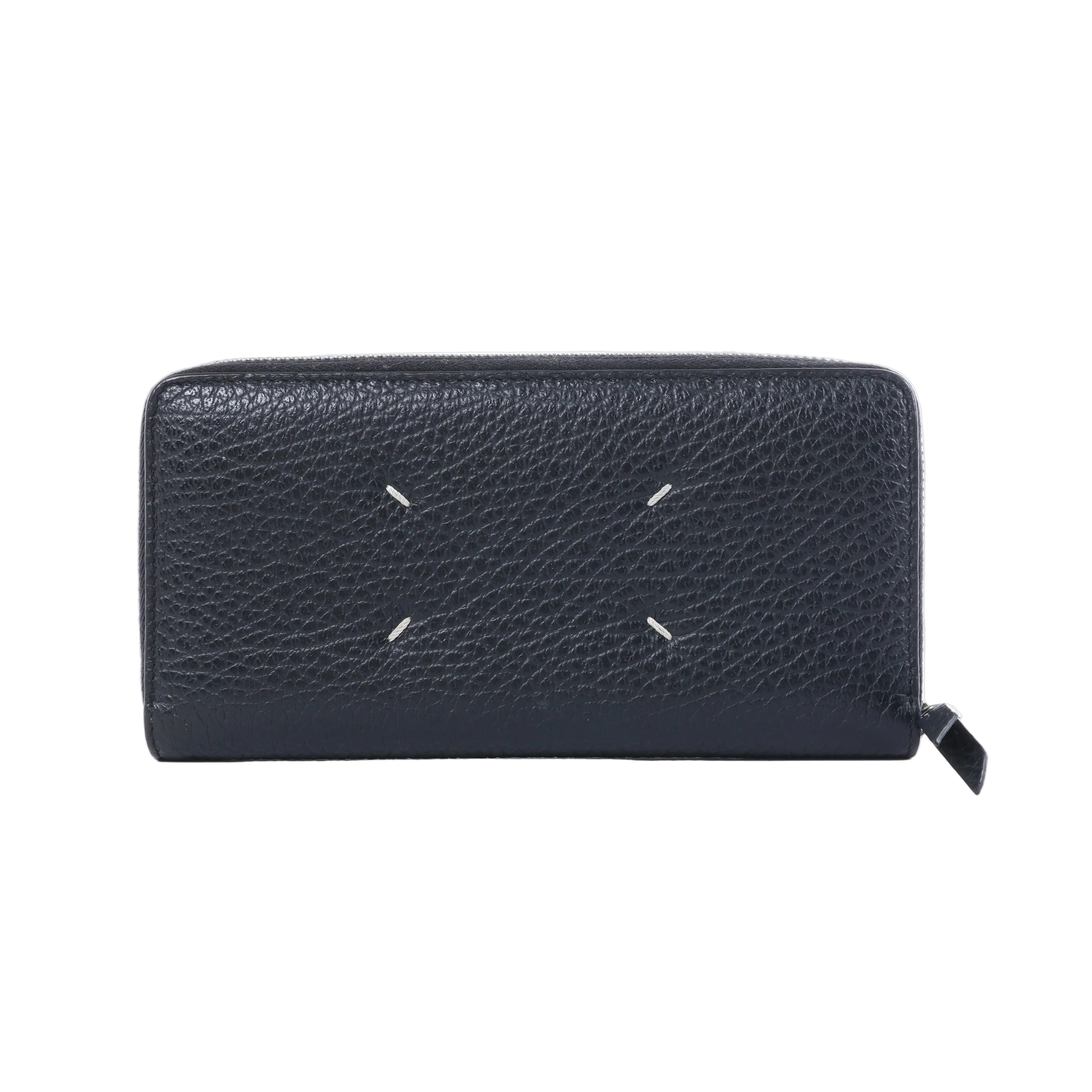 Maison Margiela black textured leather zip-around wallet with four white signature stitches and black zipper pull.