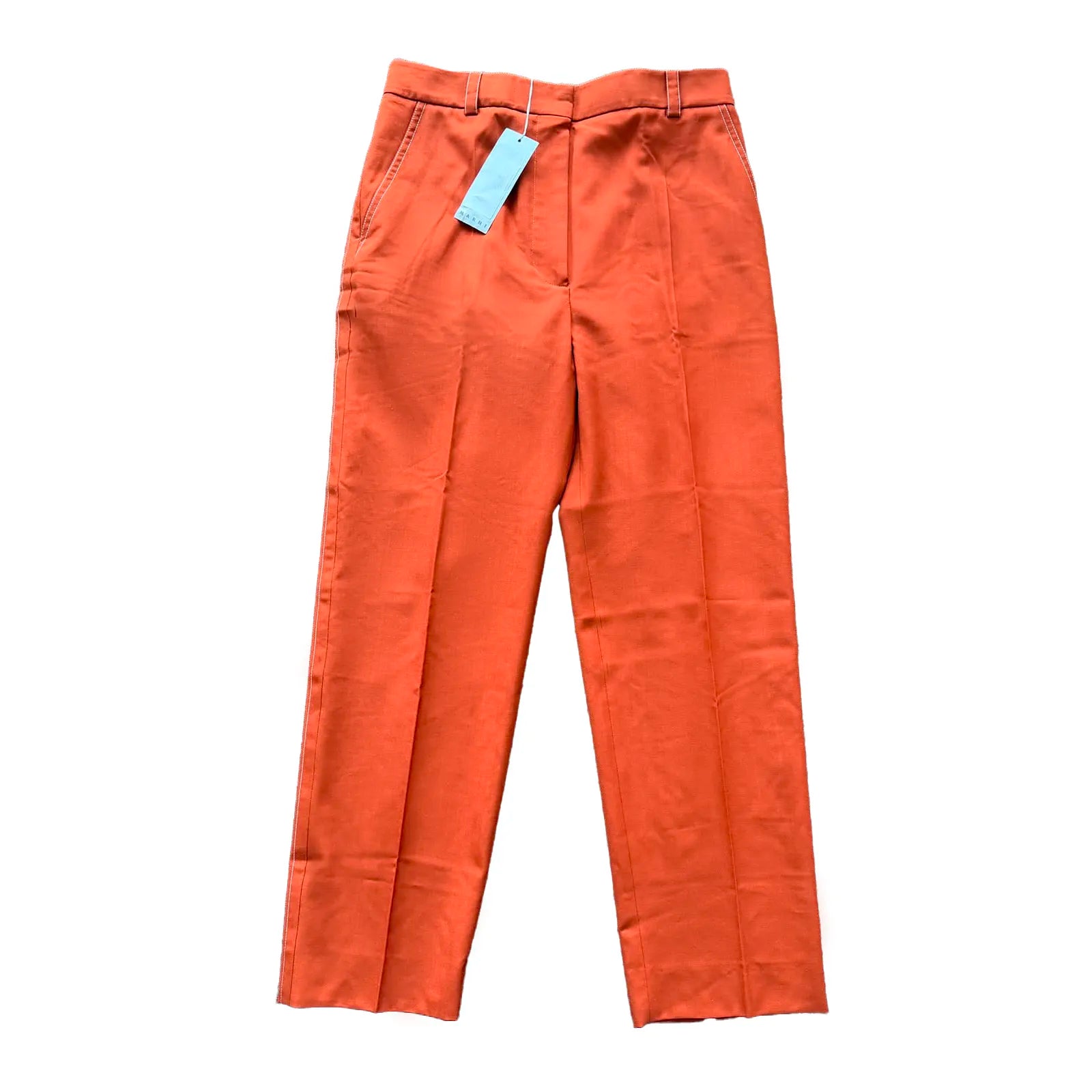 Marni orange tailored straight-leg pants with front zip closure, belt loops, side pockets and pressed creases, laid flat on a white background.