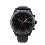 Montblanc TimeWalker black chronograph watch with black dial, red accents, 24-hour scale and perforated black strap.