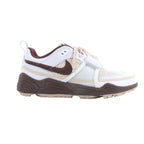 White and brown Nike x Travis Scott Zoom Field Jaxx sneakers displayed with a blue JACK shoebox and spare brown laces.