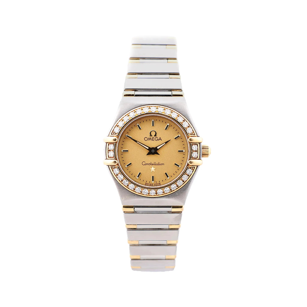 Omega Constellation watch with champagne dial, diamond-accent bezel, two-tone stainless steel and yellow gold bracelet, and gold-tone hands.