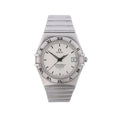 Omega Constellation stainless steel watch with silver dial, Roman numeral bezel, date window and integrated metal bracelet.