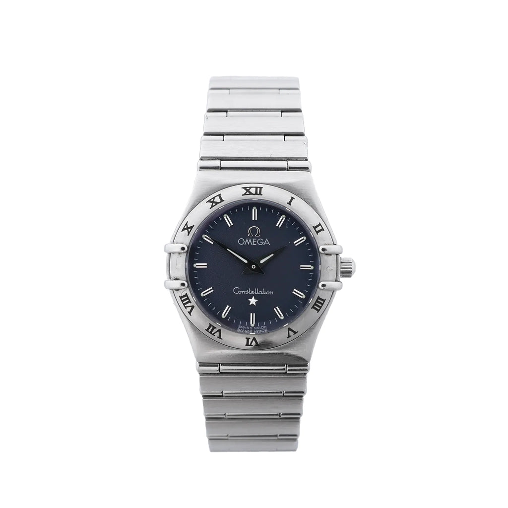 Omega Constellation stainless steel watch with navy blue dial, Roman numeral bezel, baton hour markers, black hands and integrated bracelet on white background.