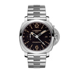 Panerai Luminor GMT watch with stainless steel bracelet, black dial with gold-tone hour markers, 24-hour scale, date window at 3 o’clock, small seconds subdial, and crown-guard lever.