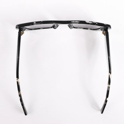 Lunettes de soleil Prada œil de chat noires PR 08Y