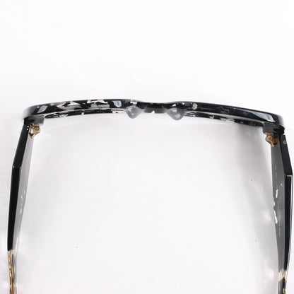 Lunettes de soleil Prada œil de chat noires PR 08Y