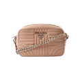 Pink Prada Diagram leather crossbody bag with stitched panel detailing, Prada Milano logo plaque, zip closure, and silver-tone chain strap