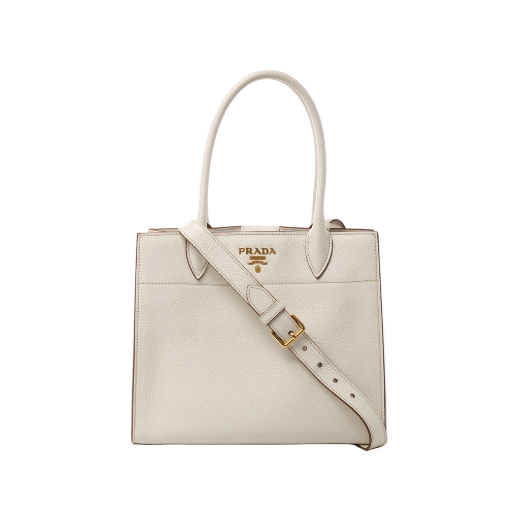 White Prada Bibliothèque leather handbag with double top handles, adjustable shoulder strap, gold-tone Prada logo and buckle hardware.
