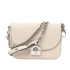 White Prada leather bag with a curved flap, silver-tone front clasp and chain strap with a studded leather section draped across the front.