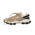 Beige Prada mesh and suede sneaker with lace-up front, black accents, chunky contrast sole and Prada triangle logo.